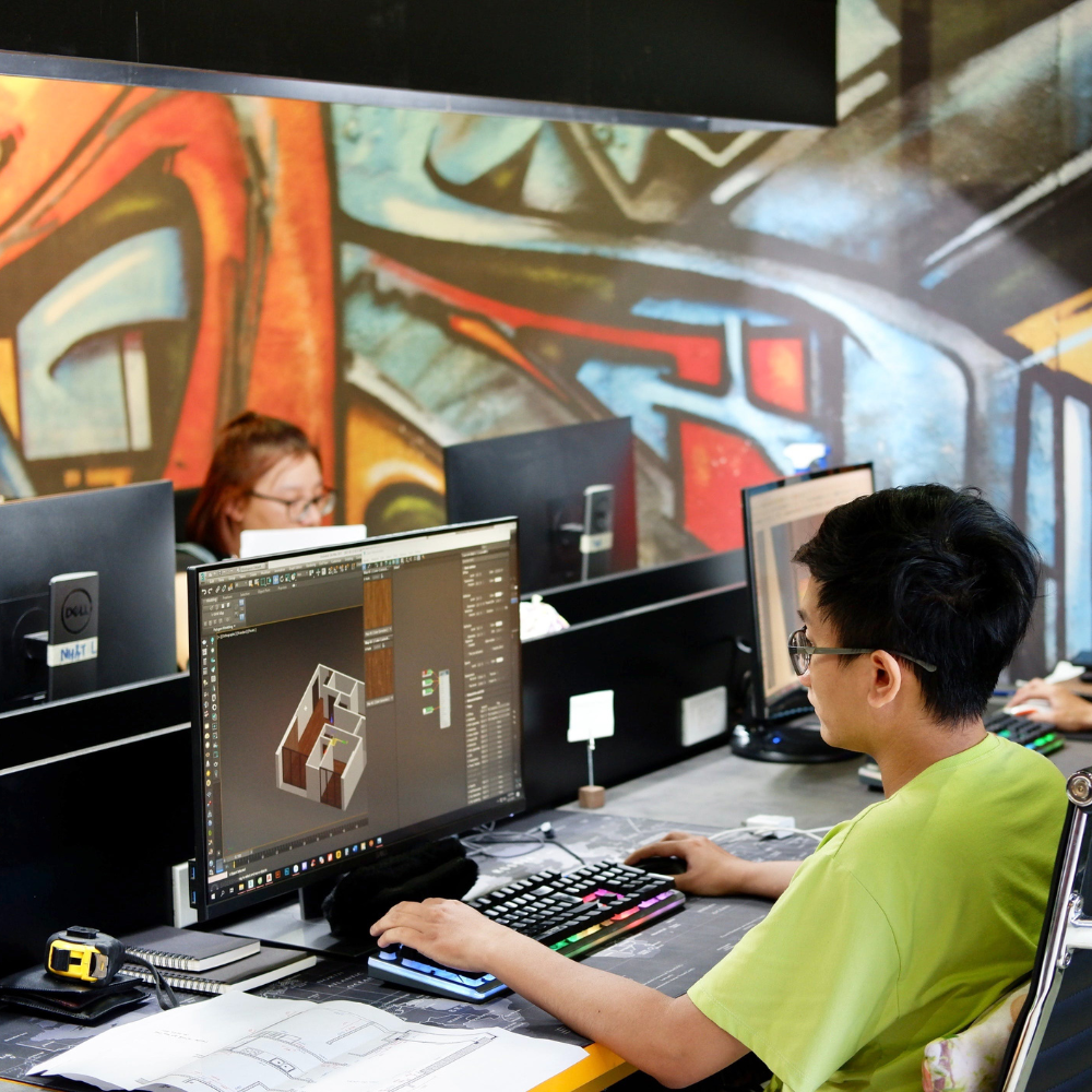 Persona diseñando un modelo 3D de arquitectura en una computadora.